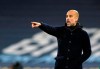 Manchester City's head coach Pep Guardiola gives instructions to his players during the Champions League group C soccer match between Manchester City and Olympiacos at the Etihad stadium in Manchester, England, Tuesday, Nov. 3, 2020. (AP Photo/Dave Thompson)
