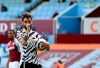 Manchester United's Bruno Fernandes celebrates after scoring his side's opening goal from penalty during the English Premier League soccer match between Aston Villa and Manchester United at Villa Park in Birmingham, England, Sunday, May 9, 2021. (Shaun Botterill/Pool via AP)
