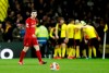 Liverpool's Andrew Robertson reacts after Watford's Troy Deeney scores his side's third goal during the English Premier League soccer match between Watford and Liverpool at Vicarage Road stadium, in Watford, England, Saturday, Feb. 29, 2020. (AP Photo/Alastair Grant)