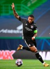 Lyon's Memphis Depay controls the ball during the Champions League semifinal soccer match between Lyon and Bayern at the Jose Alvalade stadium in Lisbon, Portugal, Wednesday, Aug. 19, 2020. (Franck Fife/Pool via AP)