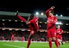 Liverpool's Sadio Mane, left, celebrates with Liverpool's Roberto Firmino after scoring his side's second goal during the English Premier League soccer match between Liverpool and Sheffield United at Anfield Stadium, Liverpool, England, Thursday, Jan. 2, 2020. (AP Photo/Jon Super)