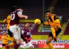 Burnley's Ashley Barnes, front left, scores his side's opening goal during the English Premier League soccer match between Burnley and Wolverhampton Wanderers at the Turf Moor stadium in Burnley, England, Monday, Dec. 21, 2020. (Gareth Copley/Pool via AP)