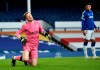 Everton's goalkeeper Jordan Pickford reacts after sustaining an injury during the English Premier League soccer match between Everton and Burnley at Goodison Park in Liverpool, England, Saturday, March 13, 2021. (Peter Powell/Pool via AP)