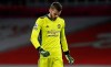 Manchester United's goalkeeper David de Gea reacts during the English Premier League soccer match between Arsenal and Manchester United at the Emirates stadium in London, Saturday, Jan. 30, 2021. (Andy Rain/Pool via AP)