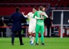 Roma's head coach Paulo Fonseca, left, celebrates with players at the end of the Europa League first leg quarterfinal soccer match between Ajax and Roma at the Johan Cruyff ArenA in Amsterdam, Netherlands, Thursday, April 8, 2021. (AP Photo/Peter Dejong)