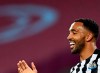 Newcastle's Callum Wilson celebrates after scoring his side's opening goal during the English Premier League soccer match between West Ham United and Newcastle United at the London Stadium in London, Saturday, Sept. 12, 2020. (Michael Regan/Pool via AP)