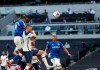 Everton's Dominic Calvert-Lewin, top, scores his side's opening goal during the English Premier League soccer match between Tottenham Hotspur and Everton at the Tottenham Hotspur Stadium in London, Sunday, Sept. 13, 2020. (Alex Pantling/Pool via AP)