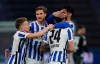 Berlin's Nemanja Radonjic celebrates with teammates after scoring his side's third goal during the German Bundesliga soccer match between Hertha BSC Berlin and SC Freiburg in Berlin, Germany, Thursday, May 6, 2021. (AP Photo/Michael Sohn, pool)