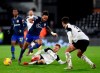 Southampton's Theo Walcott, front left, duels for the ball with Fulham's Harrison Reed during the English Premier League soccer match between Fulham and Southampton at the Craven Cottage stadium in London, Saturday, Dec. 26, 2020. (Clive Rose/Pool via AP)