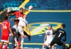 Fulham's Aleksandar Mitrovic, top, scores his side's third goal during the English Premier League soccer match between Leeds United and Fulham at Elland Road Stadium, in Leeds, England, Saturday, Sept. 19, 2020. (Carl Recine/Pool via AP)