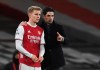 Arsenal's manager Mikel Arteta, right, gives instructions to Arsenal's Martin Odegaard during the English Premier League soccer match between Arsenal and Manchester United at the Emirates stadium in London, Saturday, Jan. 30, 2021. (Andy Rain/Pool via AP)