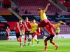 Burnley's Johann Berg Gudmundsson, top, duels for the ball with Southampton's Kyle Walker-Peters during the English Premier League soccer match between Southampton and Burnley at St. Mary's Stadium in Southampton, England, Sunday, April 4, 2021. (Dan Mullan/Pool via AP)