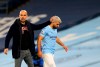 Manchester City's Sergio Aguero passes by Manchester City's head coach Pep Guardiola after being substituted during the English Premier League soccer match between Manchester City and Arsenal at the Etihad stadium in Manchester, England, Saturday, Oct. 17, 2020. (Alex Livesey/Pool via AP)