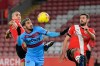 West Ham's Said Banrahma, centre, duels for the ball with Southampton's Oriol Romeu, left, during the English Premier League soccer match between Southampton and West Ham United at St. Mary's Stadium in Southampton, England, Tuesday, Dec. 29, 2020. (Justin Tallis/Pool via AP)