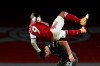 Arsenal's Alexandre Lacazette, top, duels for the ball with Manchester United's Harry Maguire during the English Premier League soccer match between Arsenal and Manchester United at the Emirates stadium in London, Saturday, Jan. 30, 2021. (Andy Rain/Pool via AP)