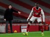 Arsenal's manager Mikel Arteta, left, gives instructions to his players during the English Premier League soccer match between Arsenal and Manchester United at the Emirates stadium in London, Saturday, Jan. 30, 2021. (Andy Rain/Pool via AP)