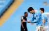 Manchester City's John Stones celebrates at the end of the English Premier League soccer match between Manchester City and West Ham United at the Etihad stadium in Manchester, England, Saturday, Feb. 27, 2021. (Gareth Copley/Pool via AP)