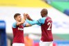West Ham's Aaron Cresswell, left, and West Ham's Angelo Ogbonna celebrate at the end of the English Premier League soccer match between Leicester City and West Ham United at the King Power Stadium, in Leicester, England, Sunday, Oct. 4, 2020. (Nigel French/Pool via AP)