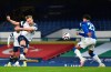 Tottenham's Harry Kane, left, scores his side's second goal during the English Premier League soccer match between Everton and Tottenham Hotspur at Goodison Park in Liverpool, England, Friday, April 16, 2021. (Peter Powell/Pool via AP)