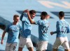 Manchester City's John Stones, second left, celebrates with teammates after scoring his side's second goal during the English Premier League soccer match between Manchester City and West Ham United at the Etihad stadium in Manchester, England, Saturday, Feb. 27, 2021. (Martin Rickett/Pool via AP)