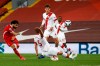 Liverpool's Mohamed Salah, left, kicks the ball during the English Premier League soccer match between Liverpool and Southampton at Anfield stadium in Liverpool, England, Saturday, May 8, 2021. (Phil Noble/Pool via AP)