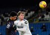 Newcastle's Jamal Lewis, left, duels for the ball with Leeds United's Patrick Bamford during the English Premier League soccer match between Leeds United and Newcastle United at Elland Road Stadium in Leeds, England, Wednesday, Dec. 16, 2020. (Stu Forster/Pool via AP)
