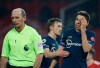 Southampton's Jan Bednarek, right, leaves the field after receiving red card during the English Premier League soccer match between Manchester United and Southampton, at the Old Trafford stadium in Manchester, England, Tuesday, Feb. 2, 2021. (Phil Noble/Pool via AP)