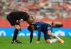 Referee Martin Atkinson, left, speaks with Chelsea's Christian Pulisic during the English Premier League soccer match between Manchester United and Chelsea, at the Old Trafford stadium in Manchester, England, Saturday, Oct. 24, 2020. (Oli Scarff/Pool via AP)