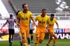 Tottenham's Harry Kane, left, celebrates after scoring his side's opening goal during the English Premier League soccer match between Newcastle United and Tottenham Hotspur at St. James' Park in Newcastle, England, Sunday, April 4, 2021. (Stu Forster/Pool via AP)