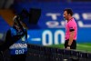 A referee watches an incident on the VAR screen before awarding a penalty to Chelsea during the Champions League Group E soccer match between Chelsea and Rennes at Stamford Bridge, London, England, Wednesday Nov. 4, 2020. (Ben Stansall/Pool via AP)