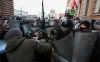 Police stand blocking approaches to the street as protesters try to break through during a protest against the jailing of opposition leader Alexei Navalny in St. Petersburg, Russia, Sunday, Jan. 31, 2021. Thousands of people have taken to the streets across Russia to demand the release of jailed opposition leader Alexei Navalny, keeping up the wave of nationwide protests that have rattled the Kremlin. Hundreds have been detained by police. (AP Photo/Valentin Egorshin)