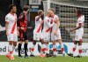 Southampton's Nathan Redmond, center, celebrates after scoring his side's third goal during the English FA Cup quarterfinal soccer match between Bournemouth and Southampton at Vitality Stadium in Bournemouth, England, Saturday, March 20, 2021. (AP Photo/Kirsty Wigglesworth)
