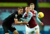 West Ham's Tomas Soucek, left, and Aston Villa's Ross Barkley challenge for the ball during the English Premier League soccer match between Aston Villa and West Ham United at Villa Park in Birmingham, England, Wednesday , Feb.3, 2021. (Tim Goode/Pool via AP)