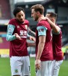 Burnley's Chris Wood, center, celebrates scoring his team's first goal during the English Premier League soccer match between Burnley and Arsenal at Turf Moor stadium in Burnley, England, Saturday, March 6, 2021.(Peter Powell/Pool via AP)