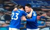 Everton's James Rodriguez, right, celebrates after scoring his side's opening goal during the English Premier League soccer match between Everton and Crystal Palace at Goodison Park in Liverpool, England, Monday, April 5, 2021.(Peter Powell/Pool via AP)
