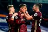 Leeds' Raphinha, center, celebrates after scoring his side's fifth goal during the English Premier League soccer match between West Bromwich Albion and Leeds United at the Hawthorns stadium, West Bromwich, England, Tuesday, Dec., 29, 2020. (Tim Keeton/Pool via AP)