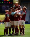 Burnley's Ashley Westwood celebrates after scoring his side's fourth goal during the English Premier League soccer match between Wolves and Burnley at the Molineux Stadium in Wolverhampton, England, Sunday, April 25, 2021. (Molly Darlington/Pool via AP)