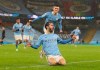 Manchester City's Phil Foden celebrates after scoring his side's opening goal during the English Premier League soccer match between Manchester City and Aston Villa at the Etihad Stadium in Manchester, England, Wednesday, Jan.20, 2021. (Martin Rickett/Pool via AP)