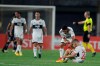Paraguay's Olimpia players leave the pitch at the end of their Copa Libertadores soccer match against Brazil's Santos, in Asuncion, Paraguay, Thursday, Oct. 1, 2020. Brazil's Santos won the match. (AP Photo/Jorge Saenz, Pool)