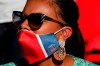 Supporter wearing PSG face mask looks on during a friendly soccer match between Paris Saint Germain and Glasgow Celtic FC at Parc des Princes Stadium in Paris, Tuesday, July 21, 2020. (AP Photo/Francois Mori)
