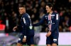 PSG's Kylian Mbappe, left, and teammate Edinson Cavani react during the French League Cup quarter final soccer match between Paris Saint Germain and Saint Etienne at the Parc des Princes stadium in Paris, Wednesday, Jan. 8, 2020. (AP Photo/Thibault Camus)