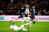 PSG's Mauro Icardi jumps over Saint Etienne's captain Loic Perrin during the French League Cup quarter final soccer match between Paris Saint Germain and Saint Etienne at the Parc des Princes stadium in Paris, Wednesday, Jan. 8, 2020. (AP Photo/Thibault Camus)