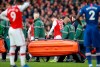 Arsenal's Calum Chambers leaves the pitch after being injured during the English Premier League soccer match between Arsenal and Chelsea, at the Emirates Stadium in London, Sunday, Dec. 29, 2019. (AP Photo/Ian Walton)