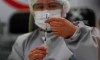 A healthcare worker prepares a dose of Russia's Sputnik V COVID-19 vaccine, at the Del Norte Hospital in El Alto, Bolivia, Saturday, Jan. 30, 2021. (AP Photo/Juan Karita)