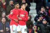 Manchester United's Marcus Rashford, left, celebrates with Manchester United's Mason Greenwood after scoring his side's first goal, during the English League Cup quarter final soccer match between Manchester United and Colchester United at Old Trafford in Manchester, England, Wednesday, Dec. 18, 2019. (AP Photo/Jon Super)