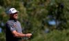 England's Lee Westwood follows his ball on the 3rd hole during the final round of the Abu Dhabi Championship golf tournament in Abu Dhabi, United Arab Emirates, Sunday, Jan. 19, 2020. (AP Photo/Kamran Jebreili)