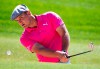 Bryson Dechambeau from the U.S. plays a bunker shot on the 2nd hole during the third round of the Dubai Desert Classic golf tournament in Dubai, United Arab Emirates, Saturday, Jan. 25, 2020. (AP Photo/Kamran Jebreili)
