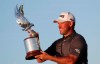 England's Lee Westwood holds the trophy after he won the Abu Dhabi Championship golf tournament in Abu Dhabi, United Arab Emirates, Sunday, Jan. 19, 2020. (AP Photo/Kamran Jebreili)