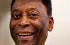 FILE - In this March 20, 2015 file photo, Brazilian soccer legend Pele smiles during a media opportunity at a restaurant in London. Rio's state legislature voted the second week of March 2021, to give Gov. Claudio Castro the authority to rename the historic Maracana stadium after Pele. (AP Photo/Kirsty Wigglesworth, File)