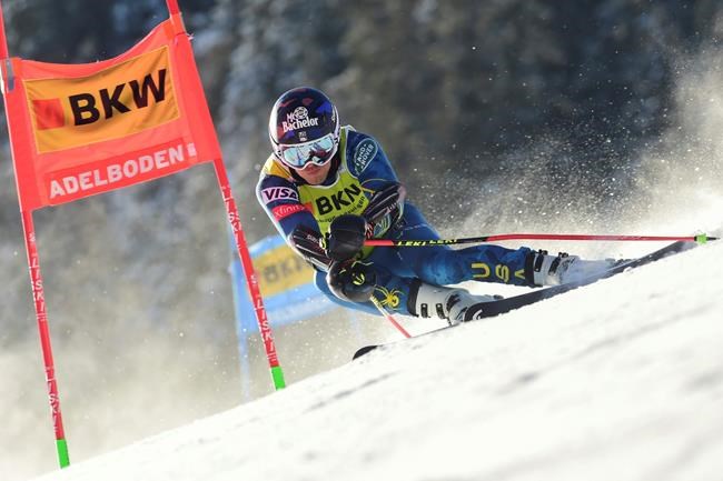United States' Tommy Ford speeds down the course during an alpine ski, men's World Cup giant slalom, in Adelboden, Switzerland, Friday, Jan.8, 2021. (AP Photo/Marco Tacca)
